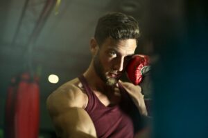 Close-up Photography of Man Wearing Boxing Gloves